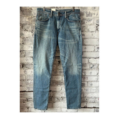 Men's Edwin Aomori Regular Tapered Denim jeans, showing the dark indigo fabric with subtle fading and classic five-pocket design.