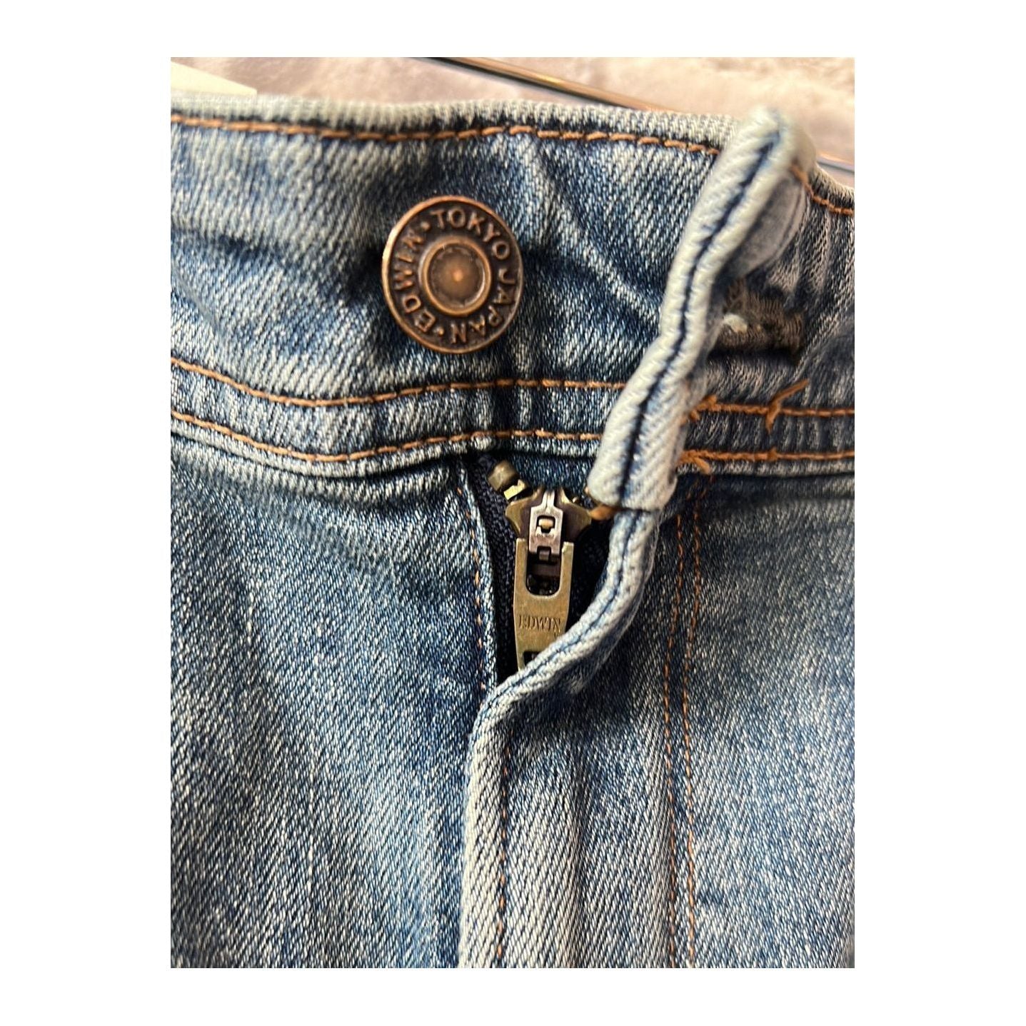 Men's Edwin Aomori Regular Tapered Denim jeans, shown in a natural pose showcasing the fit and dark indigo color.