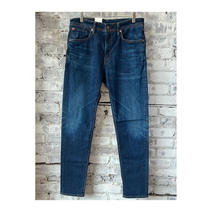 Men's Edwin Aomori Slim Taper Denim jeans in dark indigo with subtle fading and stitching details.