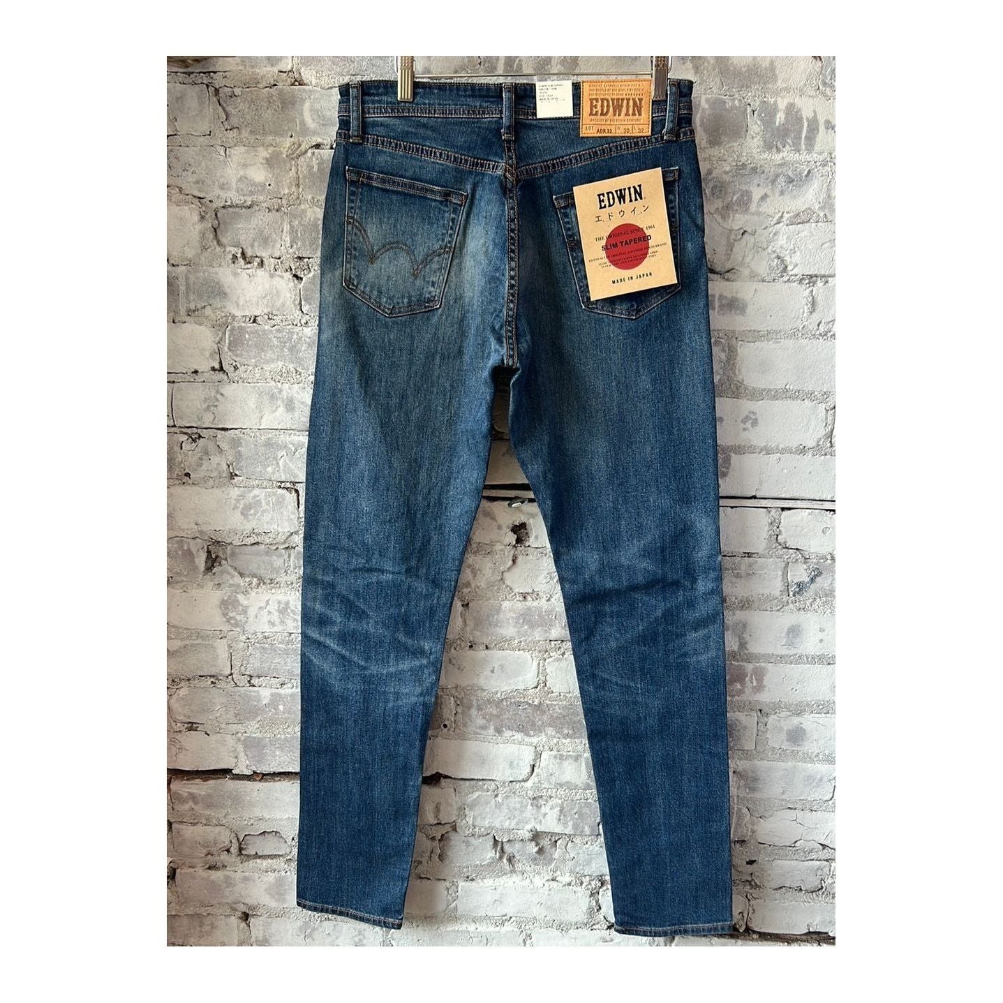 Men's Edwin Aomori Slim Taper Denim jeans in dark indigo with subtle fading, slim fit style, displayed on a white background.