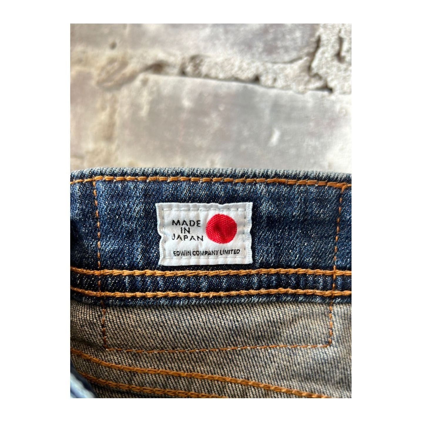 Men's Edwin Aomori Slim Taper Denim jeans in dark wash, showcasing a fitted tapered style with subtle stitching details.