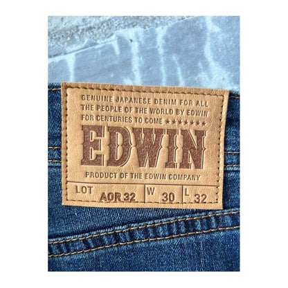 Men's Edwin Aomori Slim Taper Denim jeans in dark wash, featuring a fitted silhouette and classic five-pocket design.