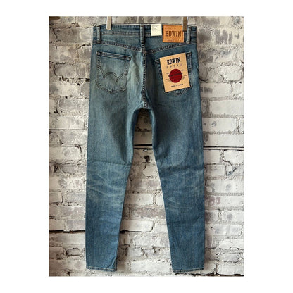 Men's Edwin Aomori Slim Taper Denim jeans in Raito color, showing a close-up of the dark indigo fabric and tapered fit.