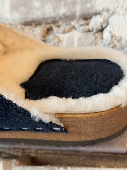 Women's Ella Suede and Lambswool Clogs in navy and white by Kunsten Clogs, featuring a stylish slip-on design and cozy materials.