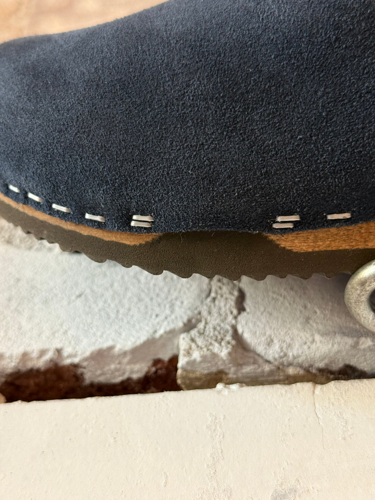 Women's navy and white Ella suede and lambswool clog by Kunsten Clogs, showcasing the stylish slip-on footwear with textured suede and cozy lambswool.
