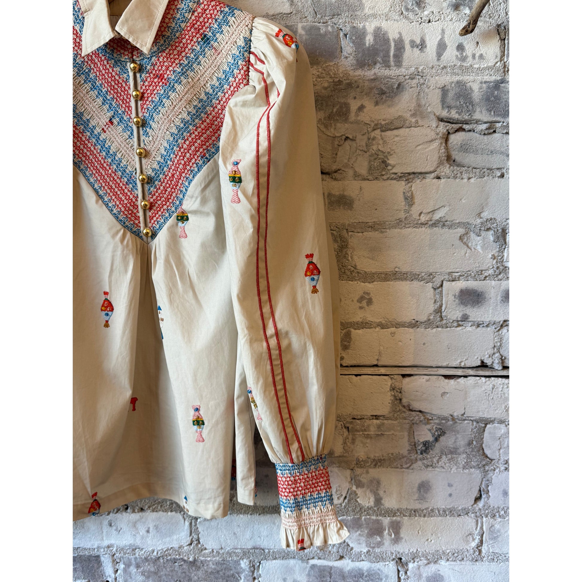 Women's embroidered smocked shirt in vanilla with multicolored floral embroidery by Hope For Flowers, featuring a relaxed fit and detailed stitching.