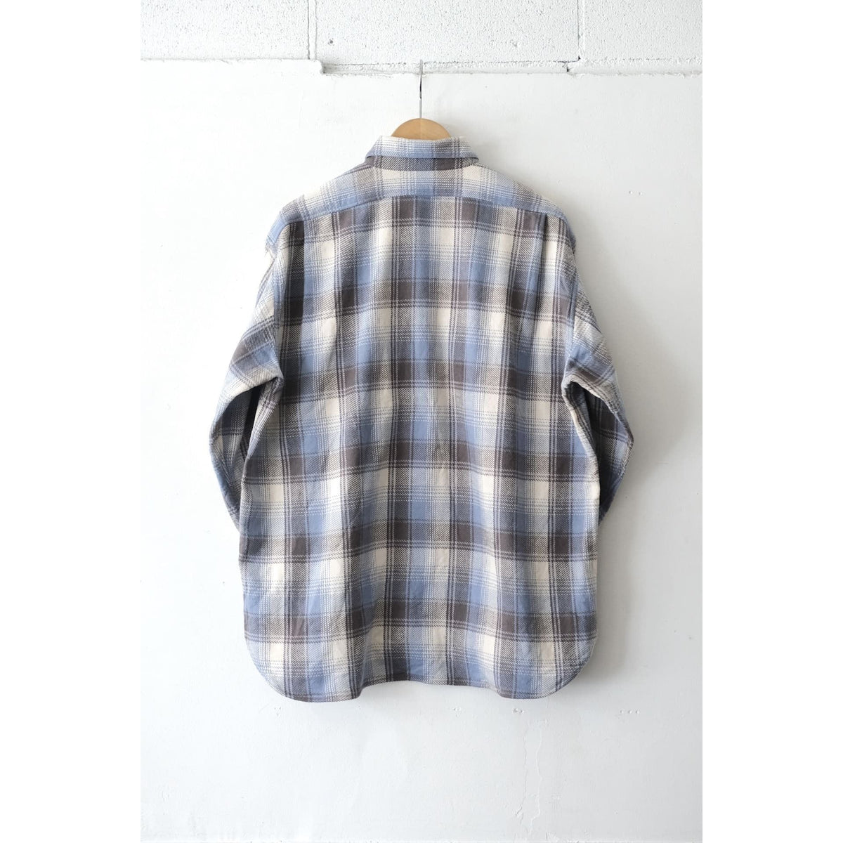 Men's blue check Fatigue Flannel Shirt by Fujito, featuring classic plaid pattern and button-up front.