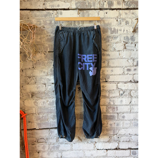 Women's Freecity Airjump Pant in Moonshrooms matte satin fabric, featuring flap and snap details for a stylish, comfortable fit.