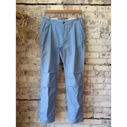 Men's Relwen Flyweight Flex Chino in Carolina Blue, lightweight casual pants with a tailored fit and belt loops.
