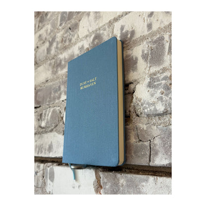 Foil embossed linen notebook in dusty blue with gold accents, stylish home accessory by Studio Portmanteau.