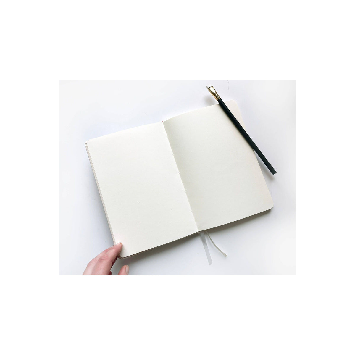 Foil embossed linen notebook in dusty blue with gold accents, stylish home accessory by Studio Portmanteau.