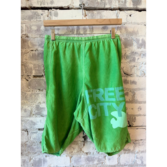 Women's Freecity matte satin back pocket shorts in Grasshopper Powder, featuring a stylish design and comfortable fit.