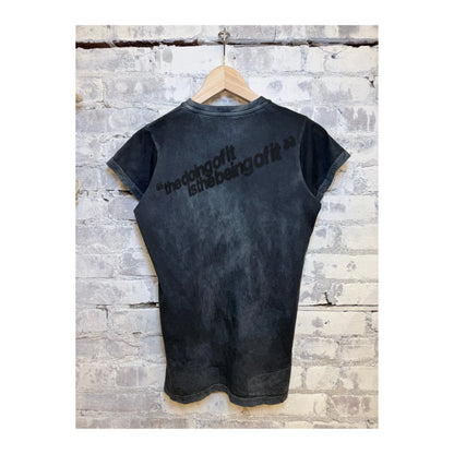 Women's Freecity "the doing of it is the being of it" vintage-style short-sleeve T-shirt with volcano powder color and relaxed fit.