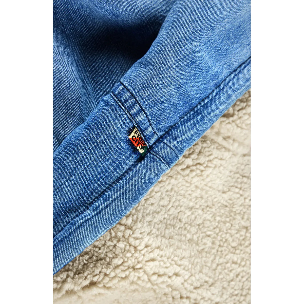 Freecity Indigo Sherpa Bear Blanket from the Freecity X Commune collection, featuring soft, cozy indigo blue fleece material.