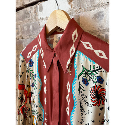 Women's French cuff shirt from Hope For Flowers paired with a Curio Scarf, featuring crisp fabric and elegant detailing.