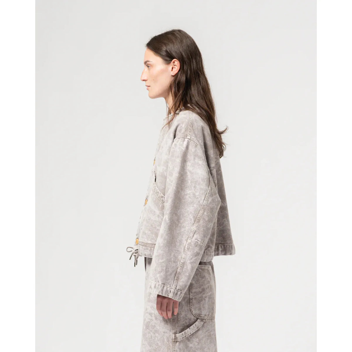 Women’s G.O.D. Nuclear Canvas Jacket in grey marble with a modern, textured design, stylishly displayed on a hanger.