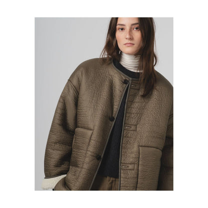 Girls of Dust G.O.D Solar Piumino nylon jacket for women in fossil and off-white, shown on a model, lightweight and stylish outdoor wear.