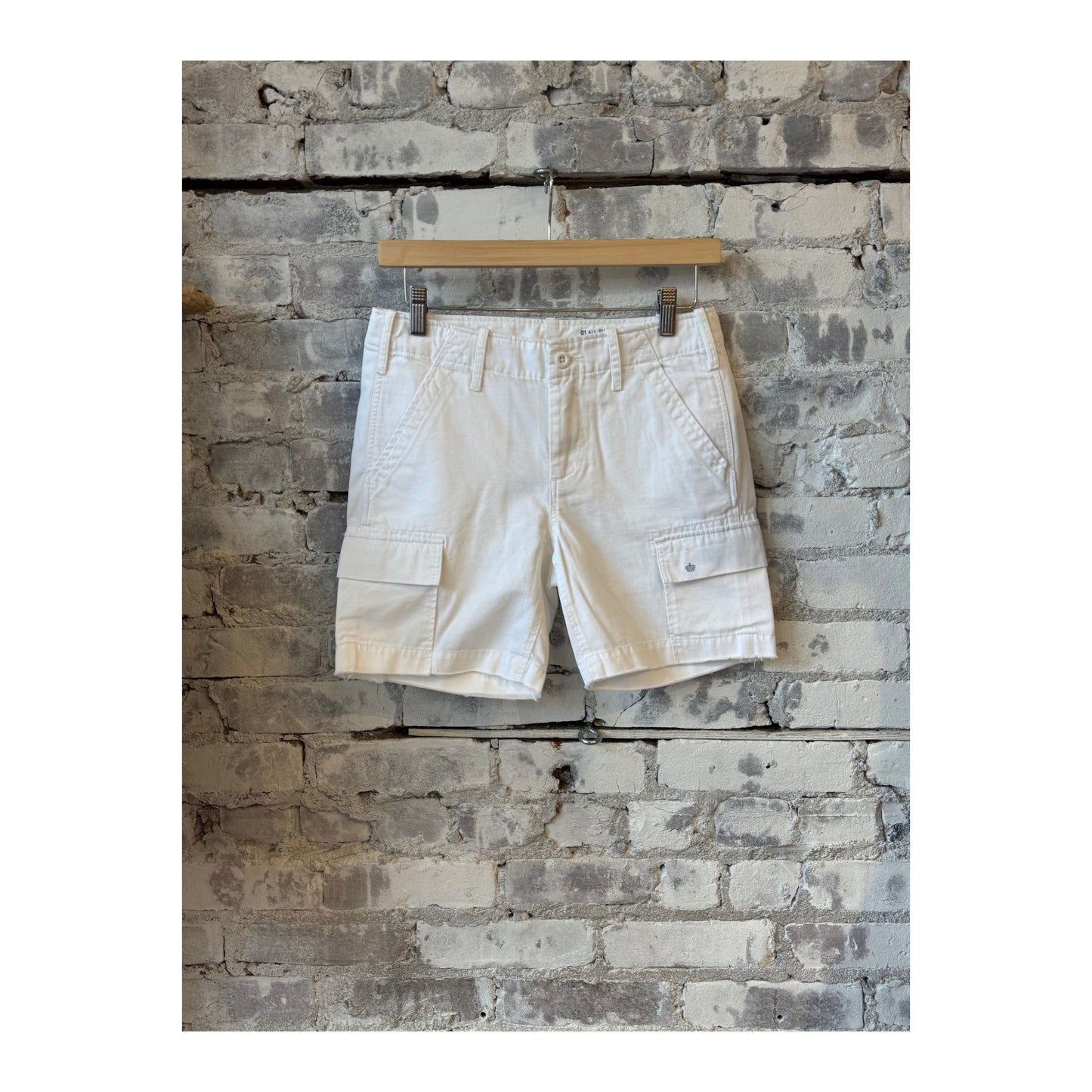 Women's white G1 Surplus Cargo Shorts showing front view with multiple pockets and relaxed fit.