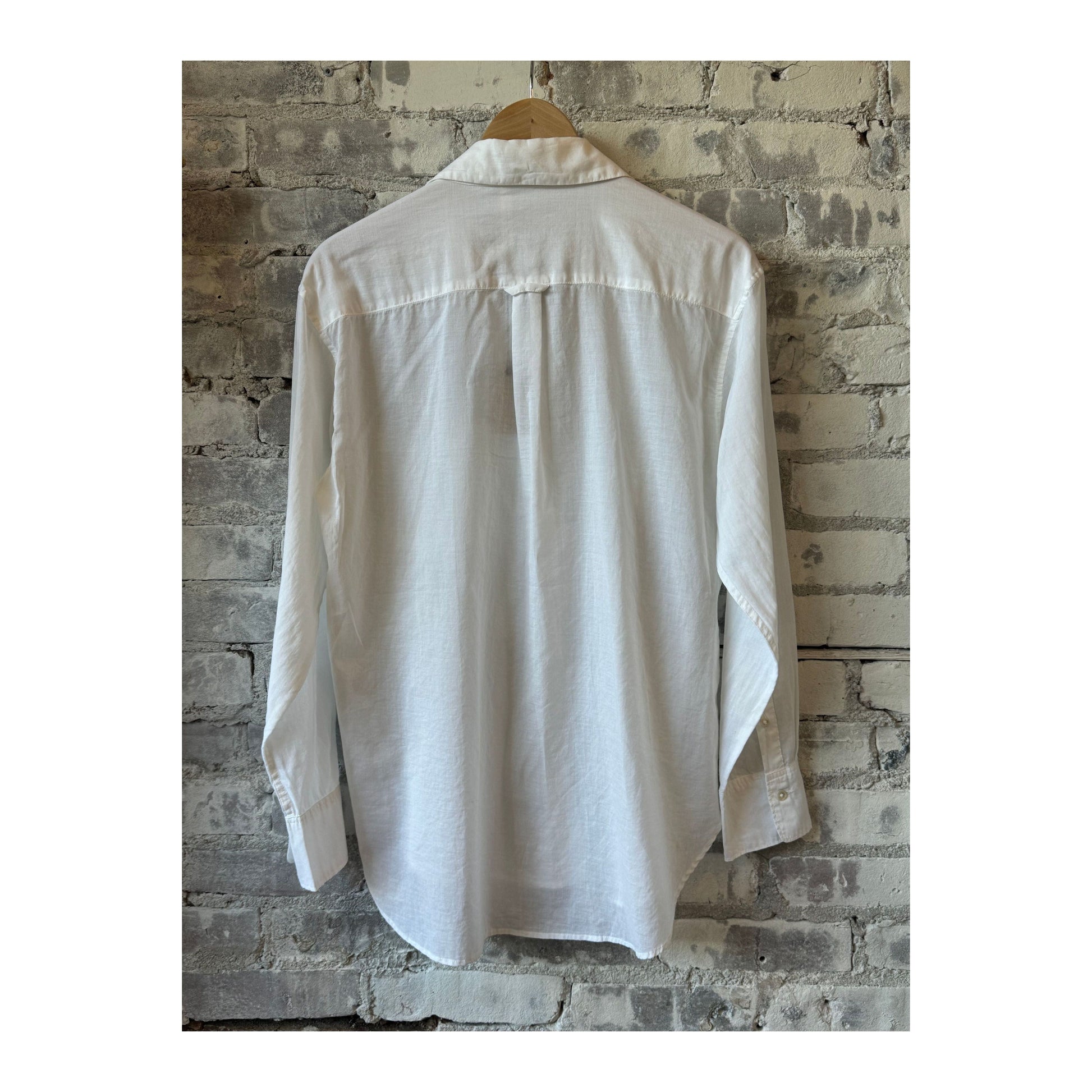 White women's Airy Shirt by G1 Women's, lightweight and breathable fabric, displayed on a hanger.