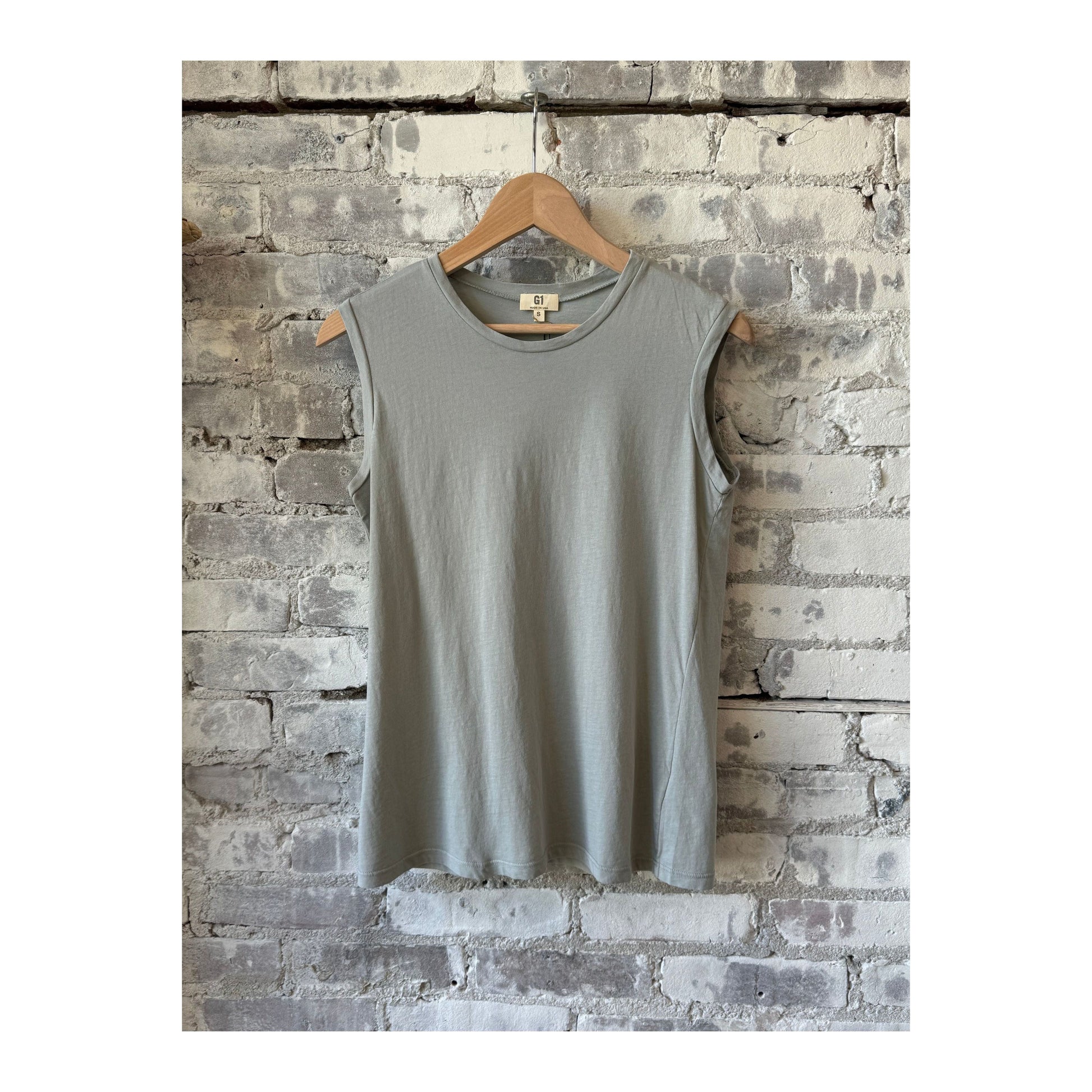 Women's sage muscle tank top by G1 Women's, sleeveless design with a relaxed fit, perfect for workout or casual wear.