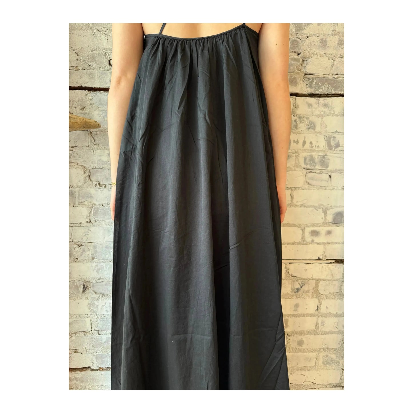 Black gathered asymmetrical women's dress by Closed Women's, featuring a stylish flowing design and unique asymmetrical hem.