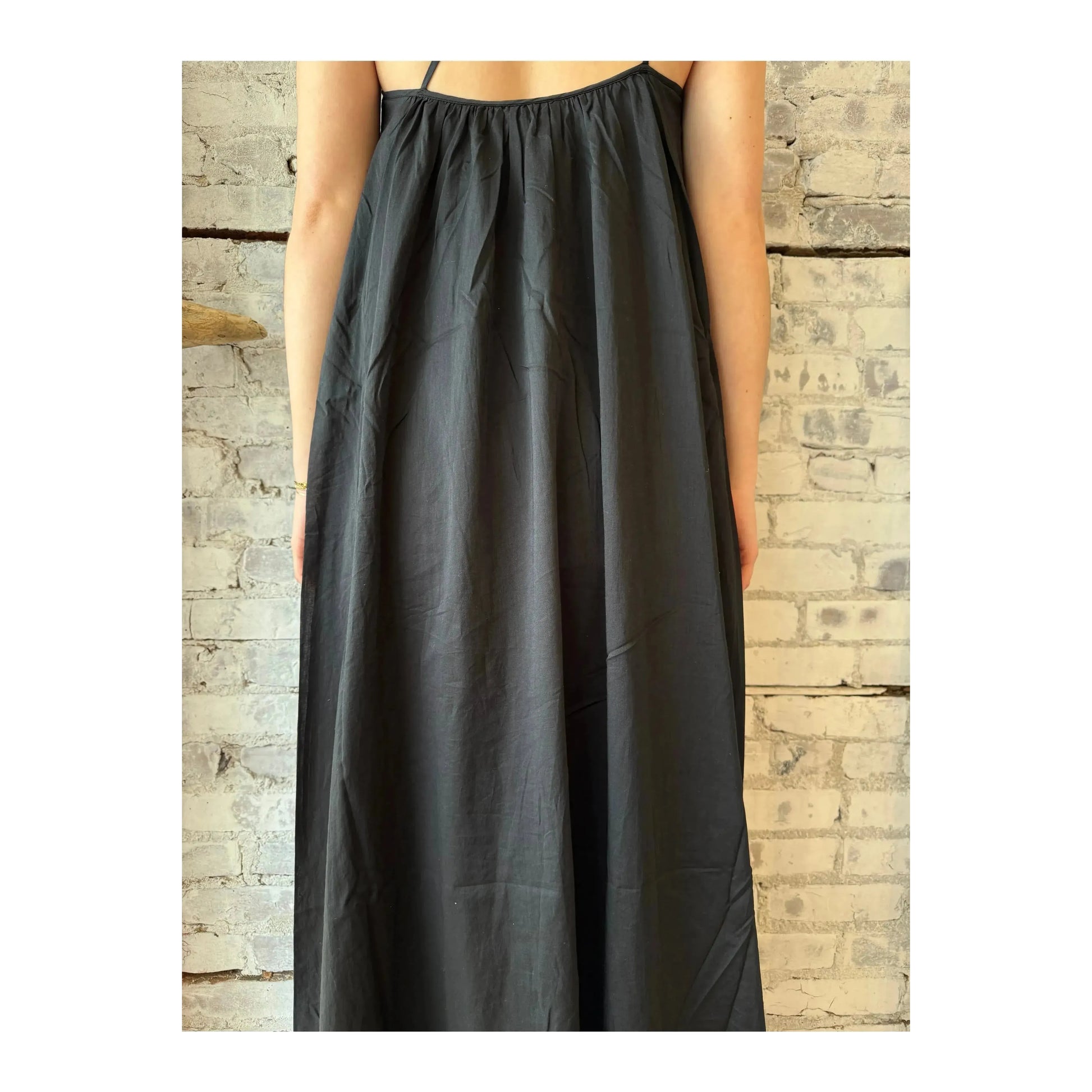 Black gathered asymmetrical women's dress by Closed Women's, featuring a stylish flowing design and unique asymmetrical hem.