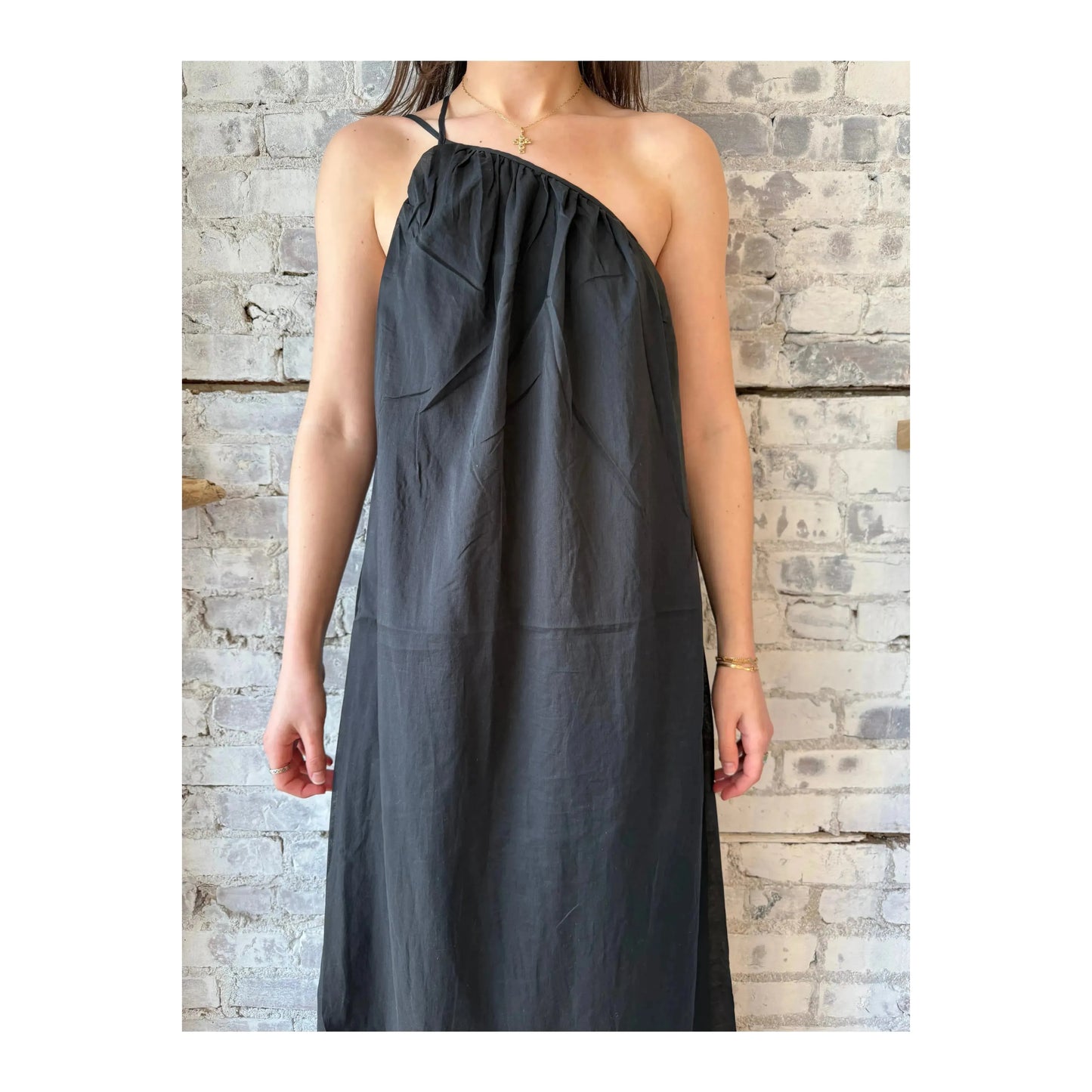 Black women's gathered asymmetrical dress by Closed Women's, featuring a stylish draped design and unique asymmetric hem.