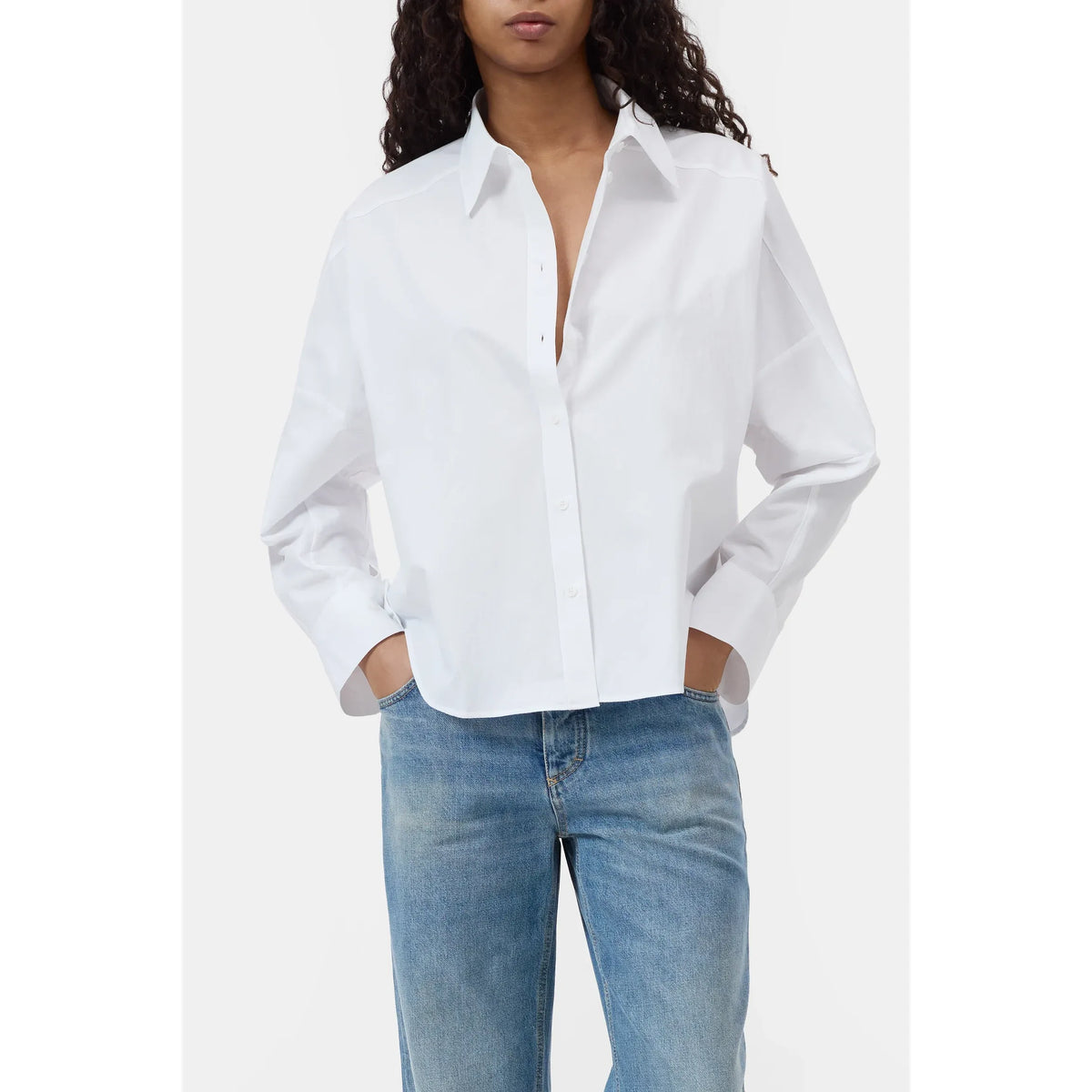 Women's gathered cotton shirt in white by Closed, displayed on a hanger with soft fabric details visible.