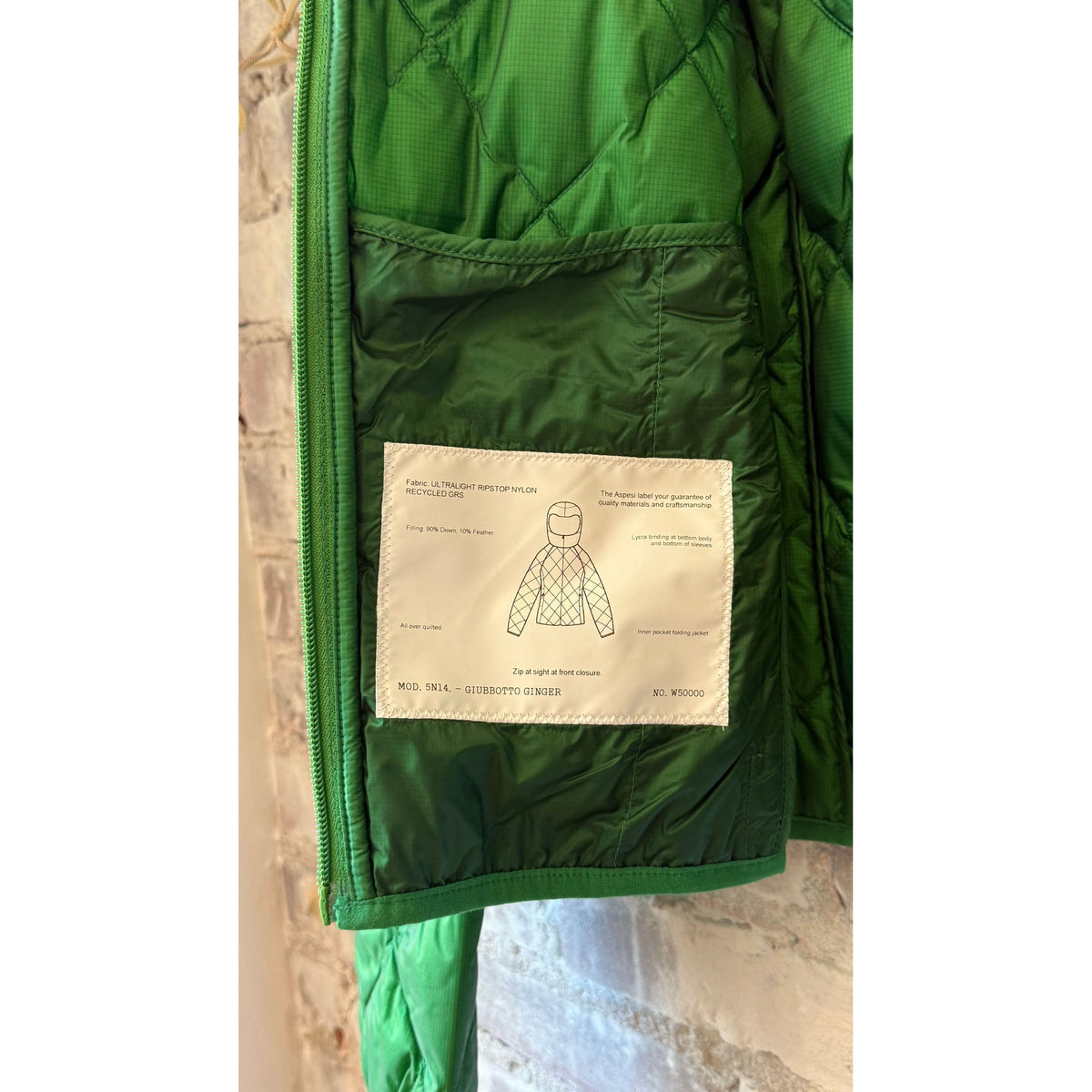 Women's Ginger Nylon Ripstop Jacket in Verde by Aspesi, shown in a stylish outdoor setting.