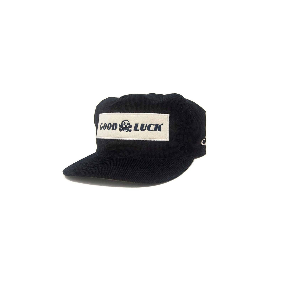 Black snapback hat with "Good Luck" embroidered logo, featuring a flat brim and adjustable strap by The Ampal Creative.