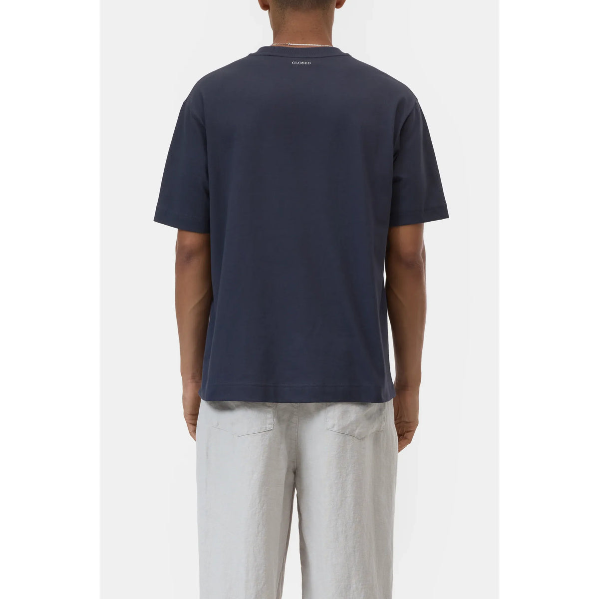 Close-up of Closed Men's "Good Times and Tan Lines" organic cotton t-shirt in magma black, showing the fabric and print details.