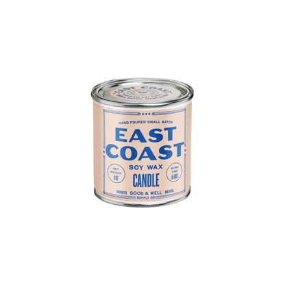 East Coast Soy Candle from Good & Well Supply Co. in a glass jar, with a lit wick and soft glow, perfect for home ambiance.