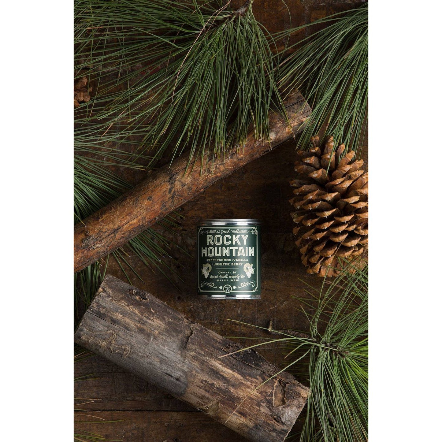 Half-pint candle featuring Rocky Mountain National Park design by Good & Well Supply Co., suitable as a home accessory.