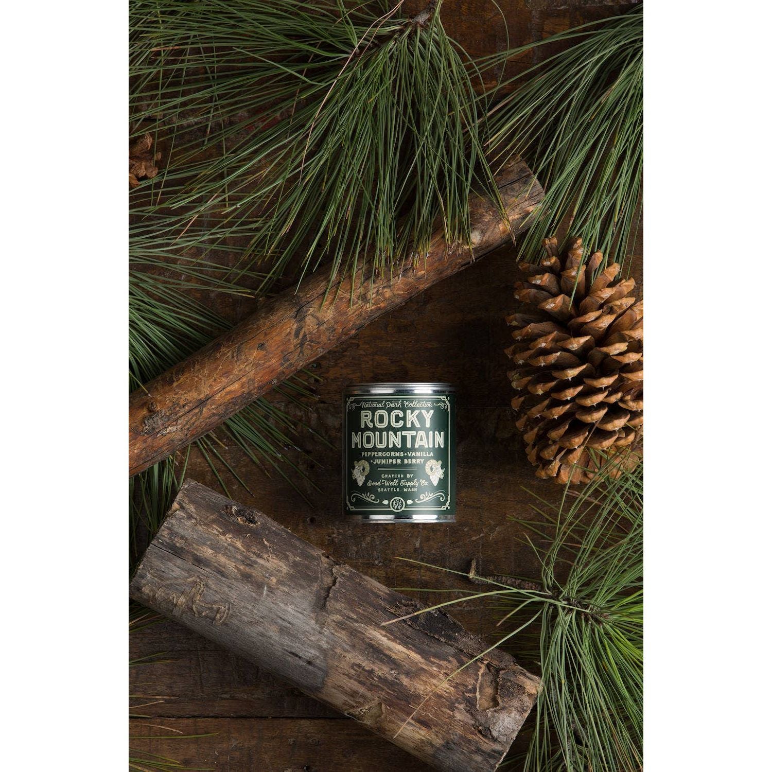 Half-pint candle featuring Rocky Mountain National Park design by Good & Well Supply Co., suitable as a home accessory.