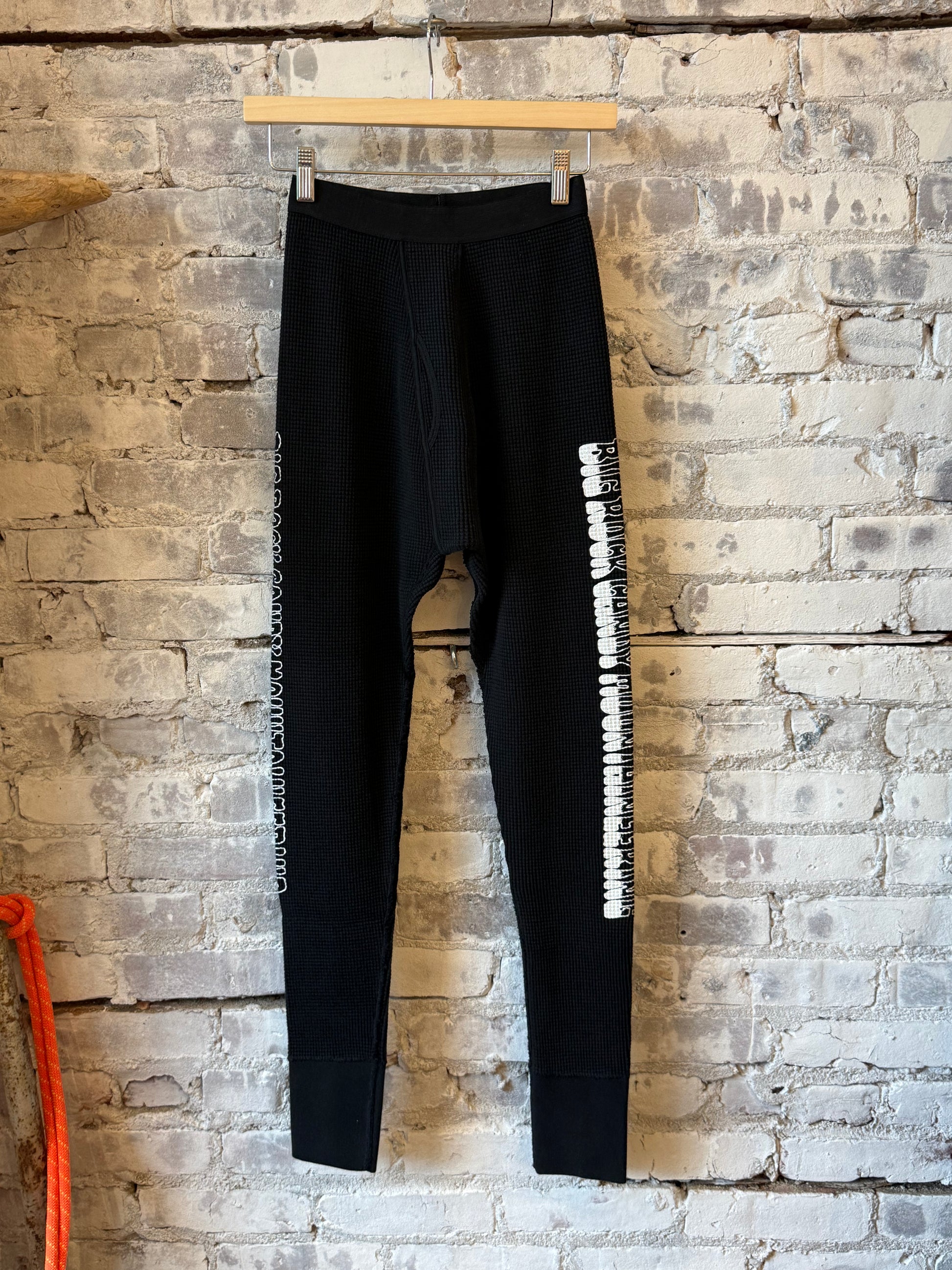 Men's black licorice Gradient Logo Long Johns by Big Rock Candy Mountaineering, featuring a subtle gradient logo design.