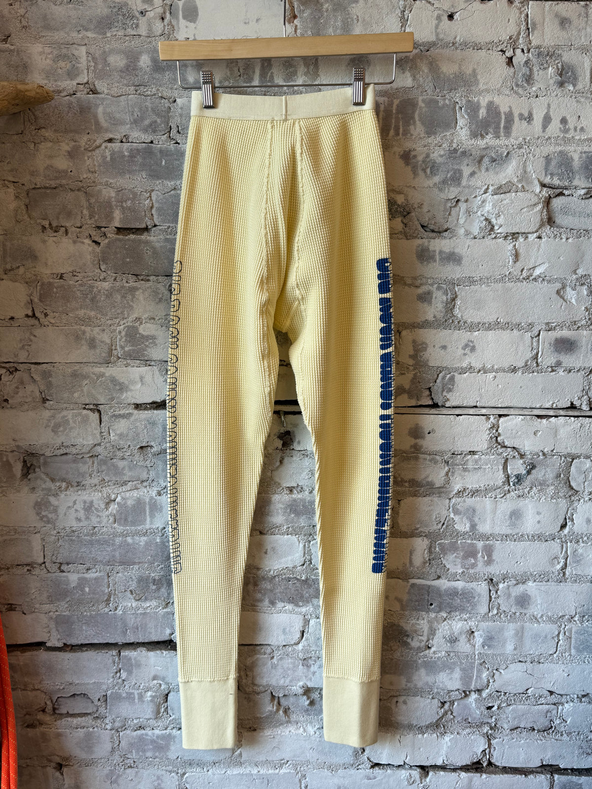 Men's gradient logo long johns in Egg Nog by Big Rock Candy Mountaineering, featuring a stylish gradient logo design.