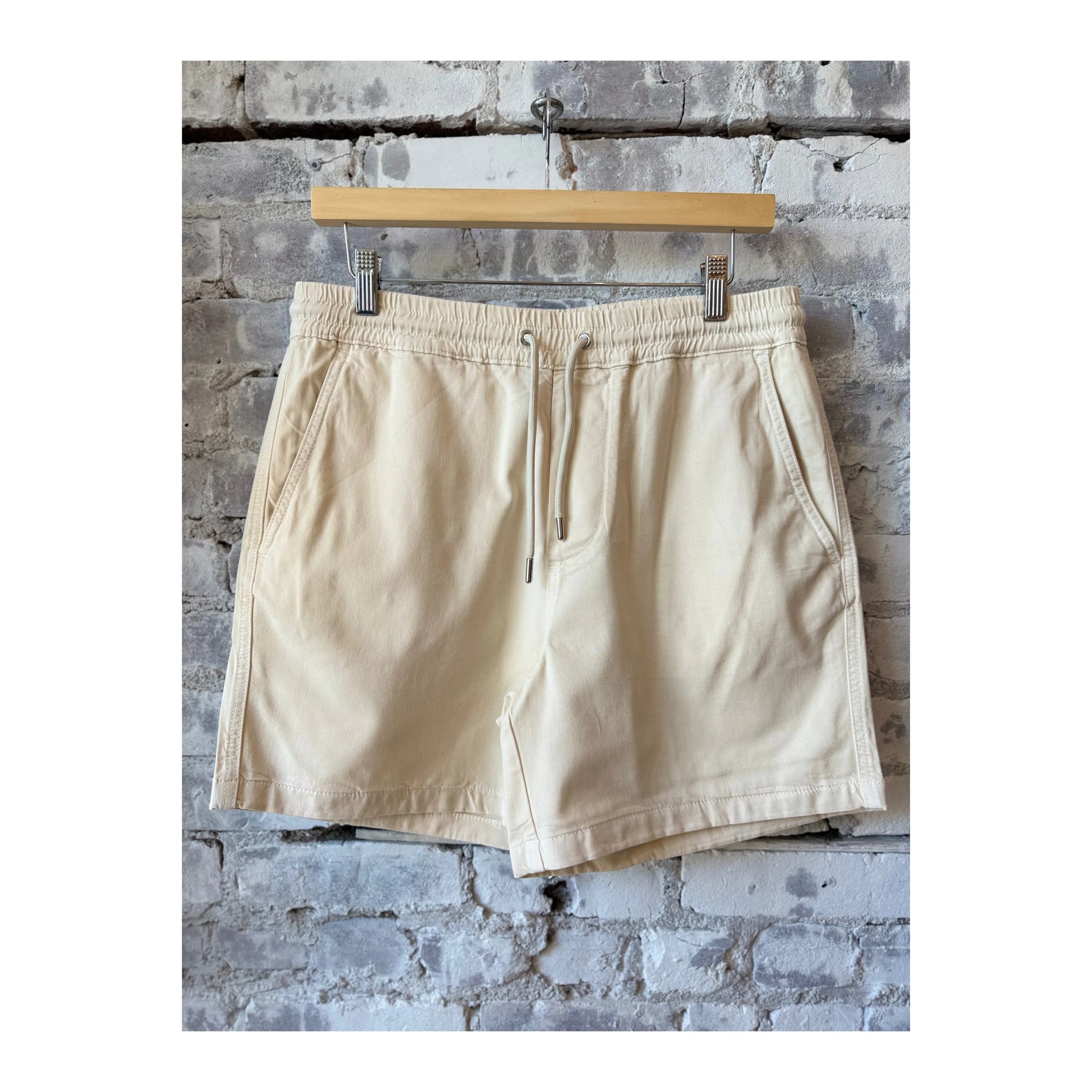 Men's NN07 Gregor Lyocell Blend Shorts in vanilla, showing a comfortable fit and casual style with fabric details.