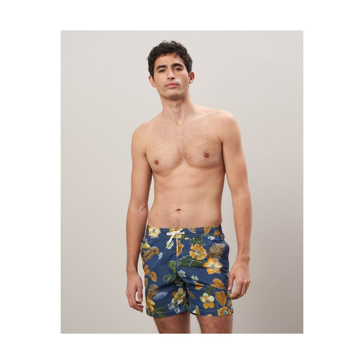 Men's navy Hibiscus printed swim trunks by Hartford Men's made from recycled nylon, featuring vibrant floral design.