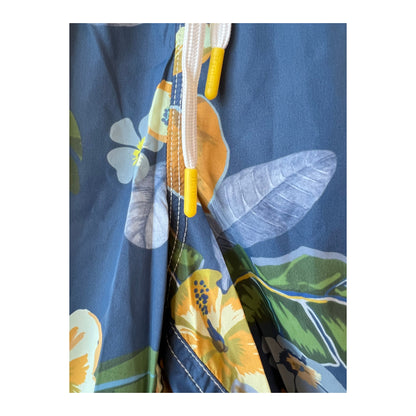 Men's navy hibiscus printed swim trunks by Hartford Men's made from recycled nylon, featuring vibrant floral pattern.
