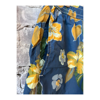 Men's navy Hibiscus printed swim trunks by Hartford Men's made from recycled nylon, featuring vibrant hibiscus floral pattern.