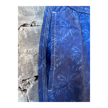 Hartford Men's blue nylon swim trunks with palm print, casual swimwear for men, featuring vibrant tropical palm design.