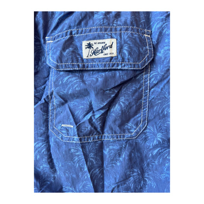 Men's Hartford nylon swim trunks with a blue palms print, featuring a comfortable fit and elastic waistband.