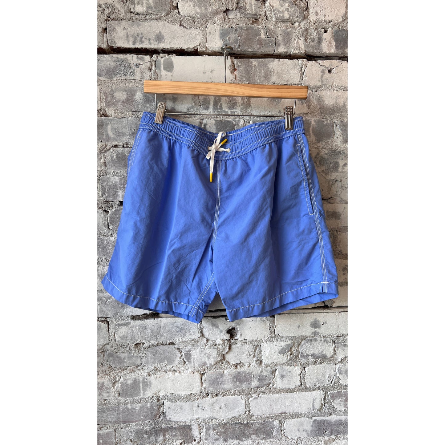 Men's Hartford Classic Sea Blue Swim Shorts with elastic waistband and side pockets, laid flat on a white background.