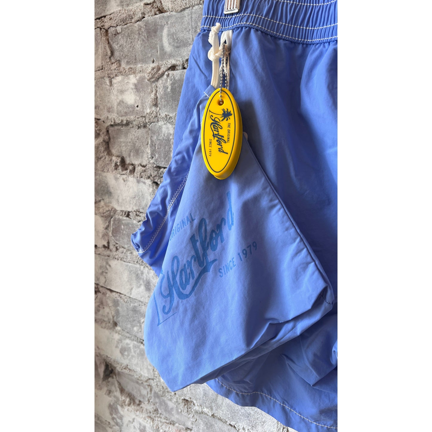 Men's Hartford Classic Sea Blue Swim Shorts featuring a relaxed fit and elastic waistband, suitable for beach and pool outings.