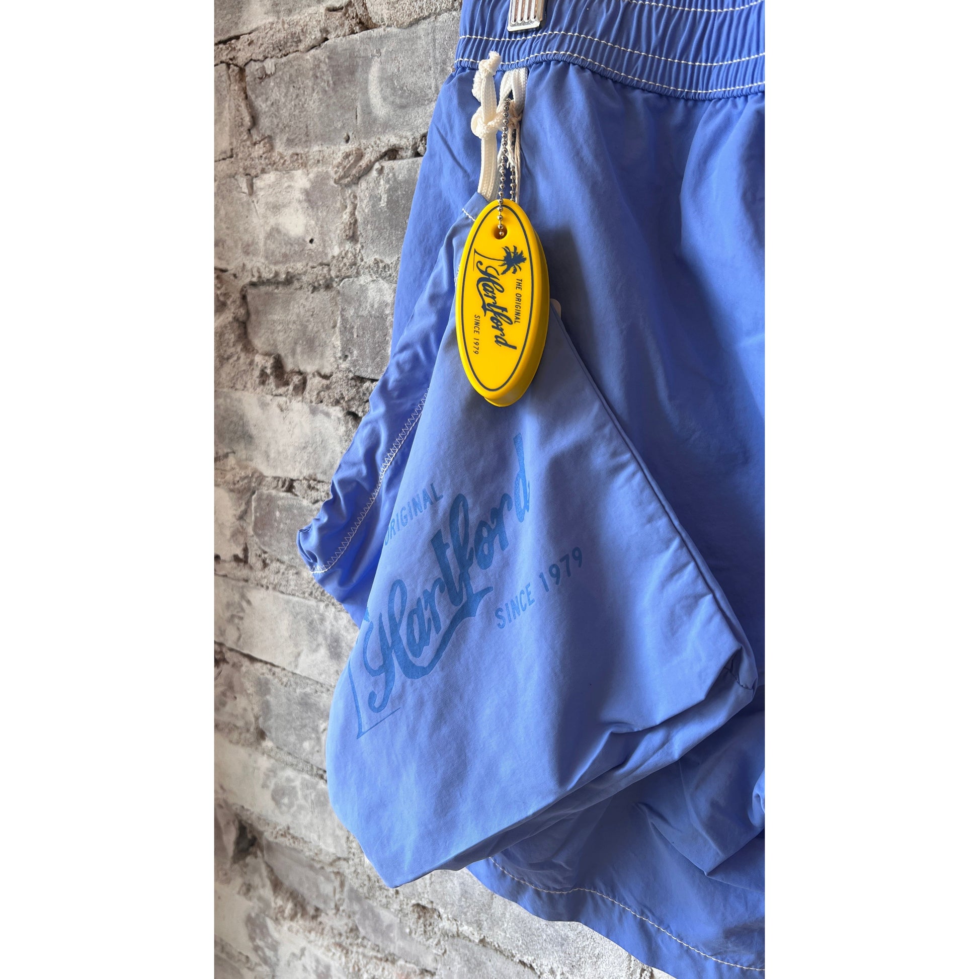 Men's Hartford Classic Sea Blue Swim Shorts featuring a relaxed fit and elastic waistband, suitable for beach and pool outings.