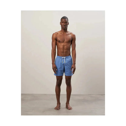 Men's Hartford Nautic Blue swim trunks with matching pochette, featuring a classic design and comfortable fit.