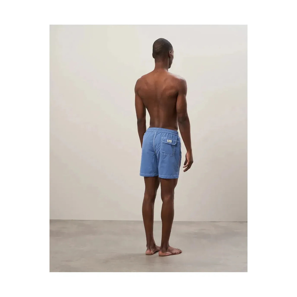 Men's Nautic Blue classic swim trunks and pochette from Hartford Men's, featuring a stylish nautical design and comfortable fit.