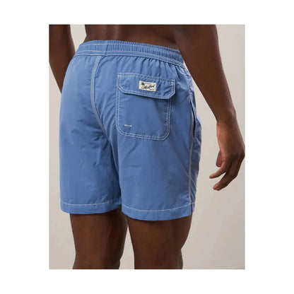 Men's Hartford Classic Swim Trunks in Nautic Blue with matching pochette, featuring a stylish summer beachwear look.
