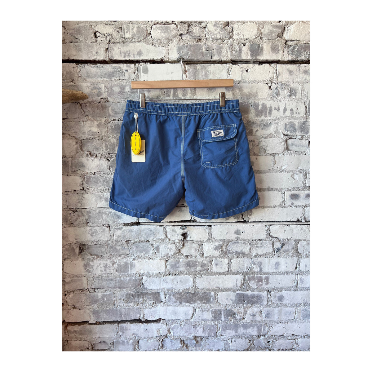 Men's Hartford Classic Swim Trunks in Nautic Blue with matching pochette, featuring a stylish and comfortable design.