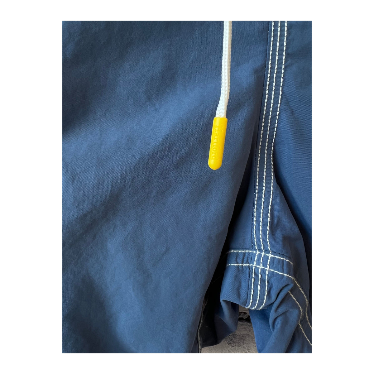 Men's Hartford Nautic Blue swim trunks with matching pochette, featuring a classic design and comfortable fit.